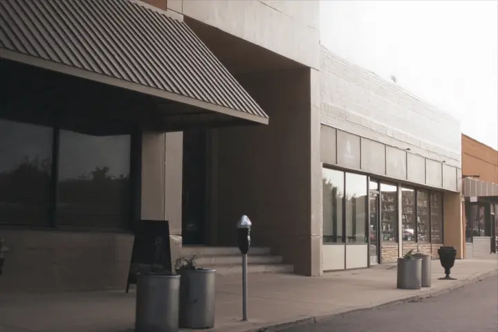 A row of independent storefronts on a main street.